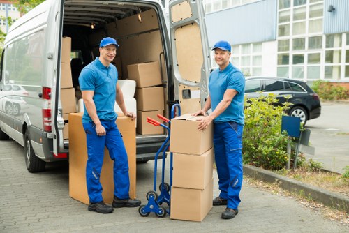 Professional man and van in Grange Park loading boxes